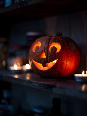 Generated still: a glowing jack-o'-lantern